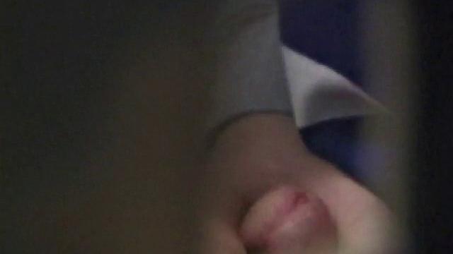 We catch up with Christian on an outdoor stairway. He leads us to a men's room with glory holes. Tere, Christian jacks off to photos in a straight porn magazine.