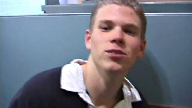 We catch up with Christian on an outdoor stairway. He leads us to a men's room with glory holes. Tere, Christian jacks off to photos in a straight porn magazine.