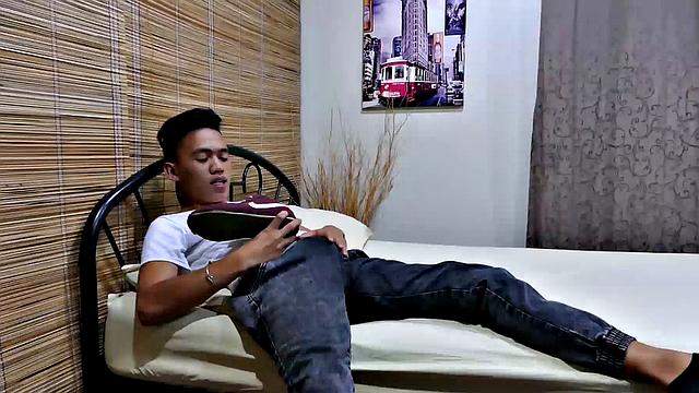 Jude has been on his feet all day and can't wait to get those shoes off and enjoy the smell of his sweaty socks. He slips off his Nike runners, after a long sniff of his shoes, instantly feels horny