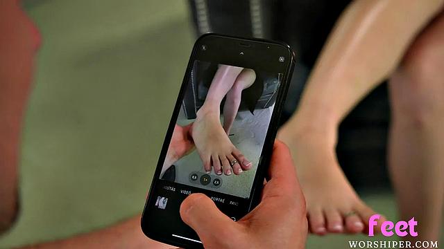 Busty babe gives lover a footjob