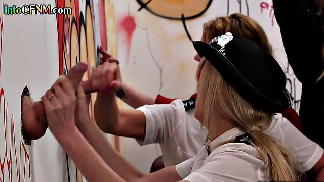 CFNM babes cock sucking in glory hole