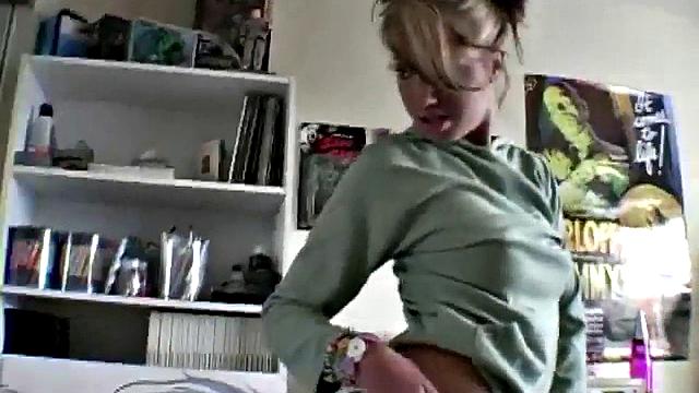 Stripteasing teen showing off her goods