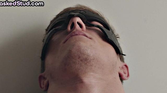 Masked stud with athletic body cums after solo handjob