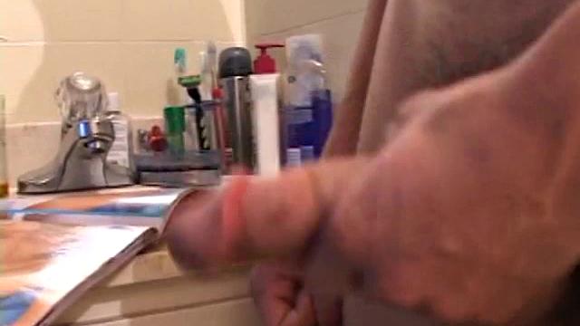 Dawson finds a magazine in the bathroom and decides to pleasure himself. A few minutes of cock stroking end with two cum shots.