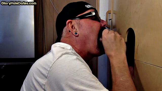 Horny DILF sucking BBC in gloryhole