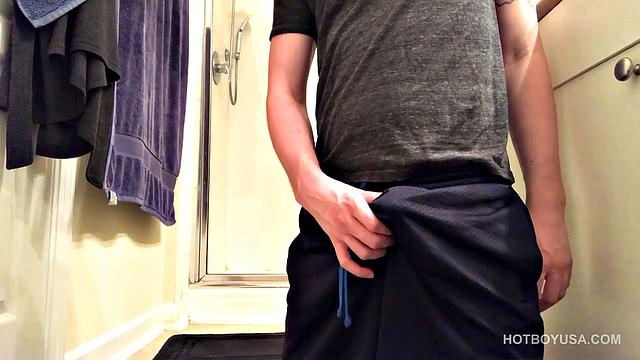 Cole Summers is on the bathroom floor, working up a boner, when we look in on him. He pulls that big stiff dick out the leg of his shorts and lets it pop out the waist band, as he edges himself.