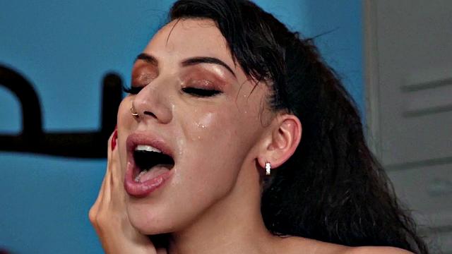 Watch this tattooed slut get pounded from behind by a big white cock in a gym locker room