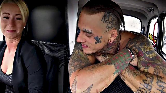 Horny bald chick gets her pussy licked & fucked by a tattooed guy in a taxi