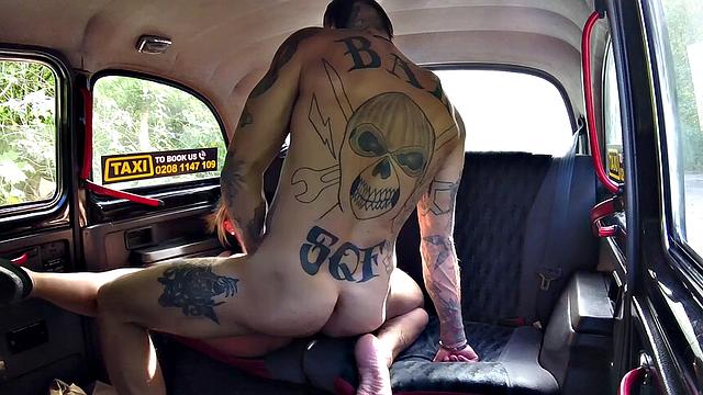 Horny bald chick gets her pussy licked & fucked by a tattooed guy in a taxi