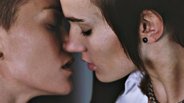 Watch these tattooed lesbian babes go wild with strap-on playtime