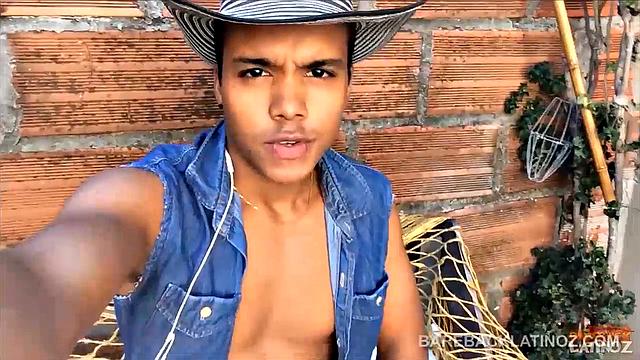 Our featured solo boy of the week is this cute Latin boy, who keeps his hat on the entire video. But, as the shorts peel off we can see a sexy little happy trail that leads to a monster uncut cock.