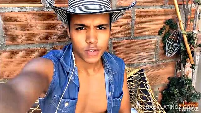 Our featured solo boy of the week is this cute Latin boy, who keeps his hat on the entire video. But, as the shorts peel off we can see a sexy little happy trail that leads to a monster uncut cock.