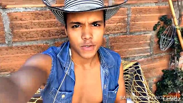 Our featured solo boy of the week is this cute Latin boy, who keeps his hat on the entire video. But, as the shorts peel off we can see a sexy little happy trail that leads to a monster uncut cock.