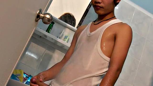 Pissing Asian twink masturbates and cums in solo vid
