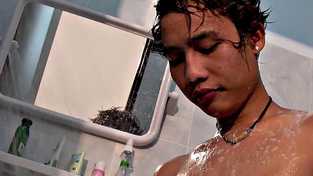 Pissing Asian twink masturbates and cums in solo vid