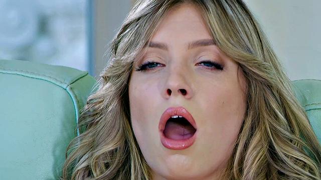 Blonde with trimmed pussy & high heels gets off solo on the couch