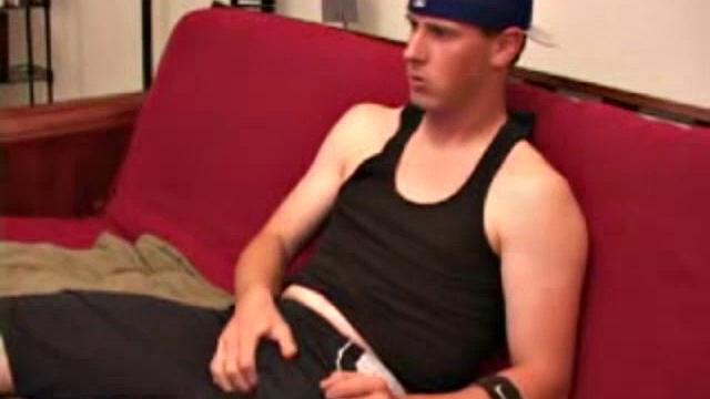 Maxx Wood works his cock under his shorts and then pulls it out to lube up. The man strokes with determination, edging himself a few times, before covering his naked body in a splattering of warm cum.