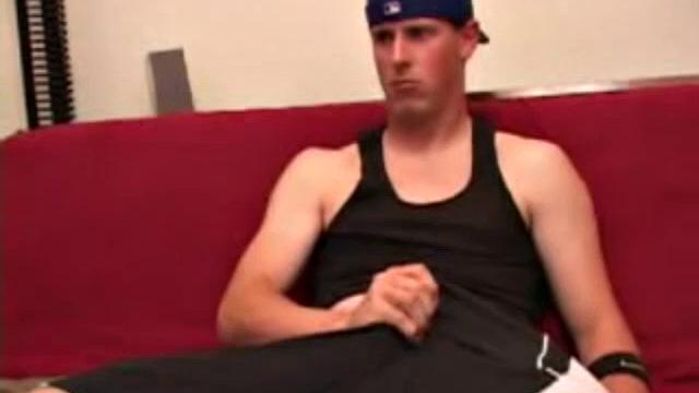 Maxx Wood works his cock under his shorts and then pulls it out to lube up. The man strokes with determination, edging himself a few times, before covering his naked body in a splattering of warm cum.