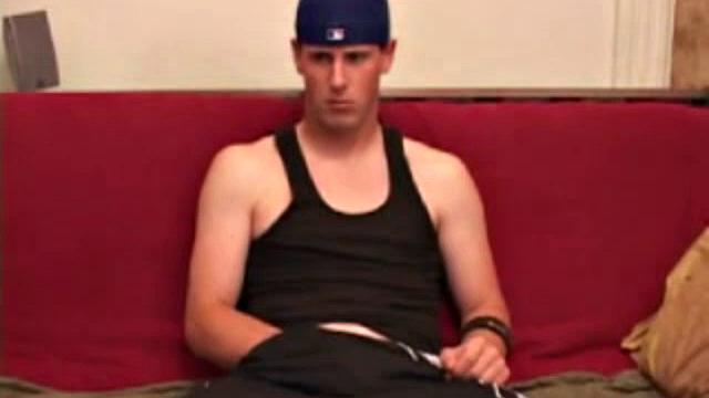 Maxx Wood works his cock under his shorts and then pulls it out to lube up. The man strokes with determination, edging himself a few times, before covering his naked body in a splattering of warm cum.