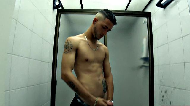 Canzio strips naked to reveal his slim, smooth and inked body and quickly gets his cock hard. He kicks back on a sofa and starts stroking that Latin meat with determination.