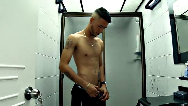 Canzio strips naked to reveal his slim, smooth and inked body and quickly gets his cock hard. He kicks back on a sofa and starts stroking that Latin meat with determination.