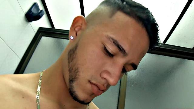 Canzio strips naked to reveal his slim, smooth and inked body and quickly gets his cock hard. He kicks back on a sofa and starts stroking that Latin meat with determination.