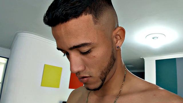 Canzio strips naked to reveal his slim, smooth and inked body and quickly gets his cock hard. He kicks back on a sofa and starts stroking that Latin meat with determination.