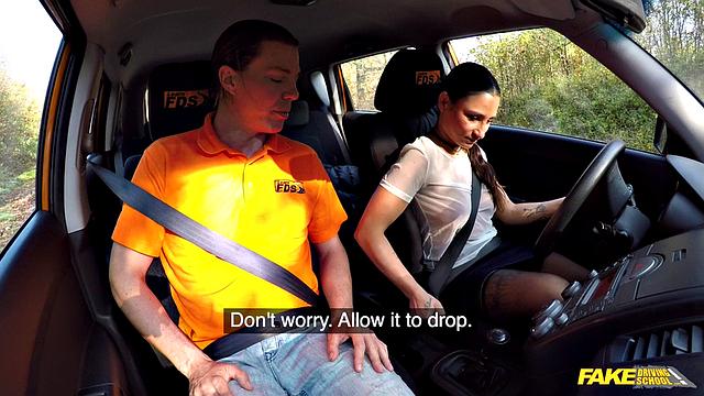 Tattooed brunette fucks for license