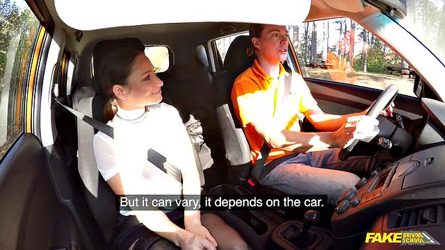 Tattooed brunette fucks for license