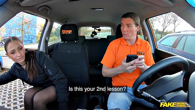 Tattooed brunette fucks for license