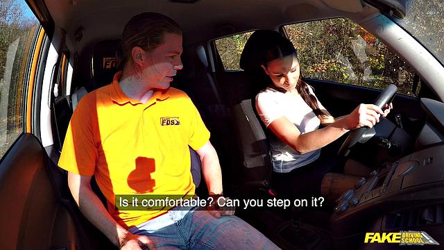 Tattooed brunette fucks for license