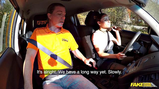 Tattooed brunette fucks for license