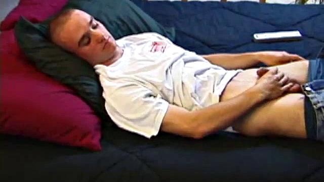 A shaved head and a naughty but nice looks belong to Kenny. Already shirtless, he pulls his pants and boxers down around his ankles and gets to work on his thick cock.