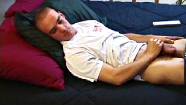 A shaved head and a naughty but nice looks belong to Kenny. Already shirtless, he pulls his pants and boxers down around his ankles and gets to work on his thick cock.