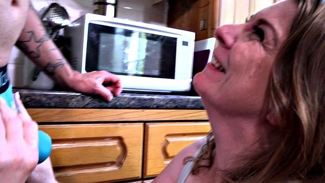 Busty mom in the kitchen