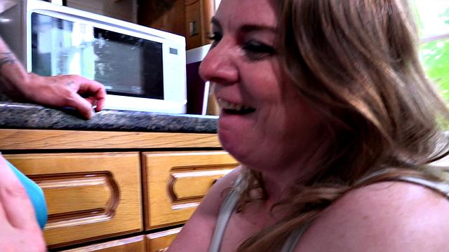 Busty mom in the kitchen