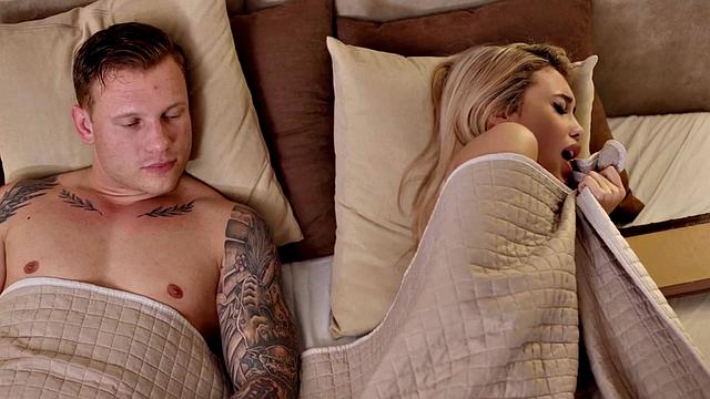 Passionate couple making love after eating in bed