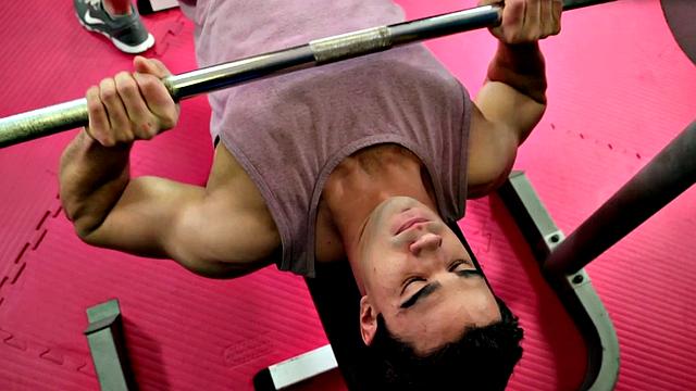 Amateur hunk strips and masturbates in the gym