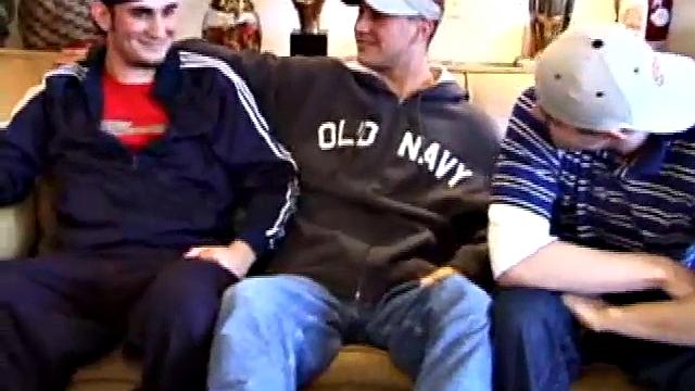 Lukas, Kenny and Timmy are hanging out and decide to explore each other in a threesome. Kenny slides to his knees to blow Lukas, while Timmy watches and rubs his cock head.