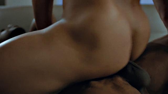 Watch this muscular ebony babe ride a BBC bareback in the living room