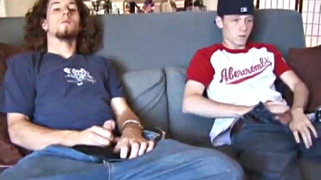 We join Adam and EJ with their dicks already out and jeans down. Curious EJ leans over and starts stroking Adam's cock. Adam helps EJ out by going down on him. EJ wants to try cock sucking, so he takes Adam's cock into his mouth.