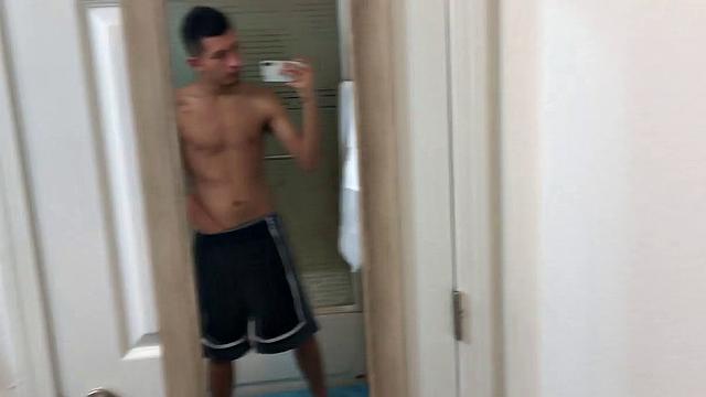 Slim and smooth Roman is in the bathroom, wearing only a pair of shorts. The young Latino gropes at his package until he's boned up. Then the shorts are pushed down to reveal his big uncut dick.