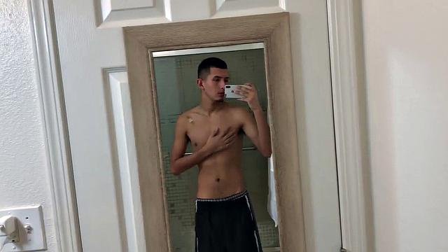 Slim and smooth Roman is in the bathroom, wearing only a pair of shorts. The young Latino gropes at his package until he's boned up. Then the shorts are pushed down to reveal his big uncut dick.