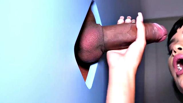 Big TS babe sucks gloryhole cock in closeup BJ