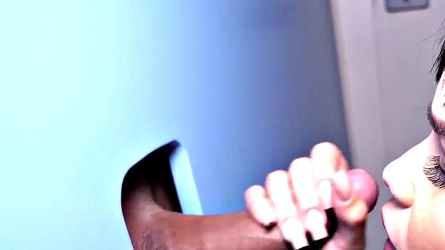 Big TS babe sucks gloryhole cock in closeup BJ