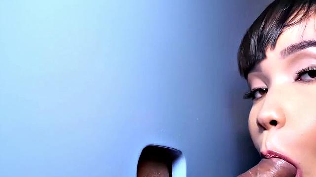 Big TS babe sucks gloryhole cock in closeup BJ