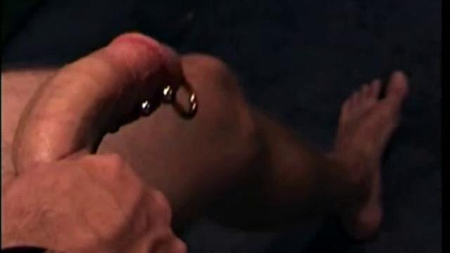 After the straight porno begins playing, Troy strips naked and begins stroking his cock, as the camera explores all the of his body.