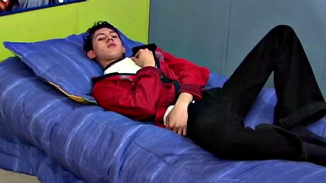 Latin twink Angel on bed strips down to underwear, grabs uncut cock, works up a stiff one, gets naked, jerks off