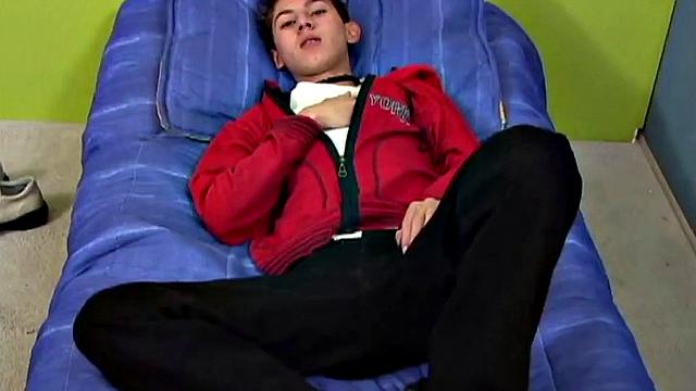 Latin twink Angel on bed strips down to underwear, grabs uncut cock, works up a stiff one, gets naked, jerks off