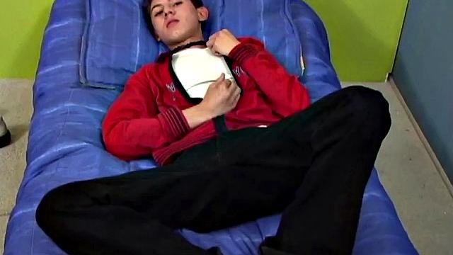 Latin twink Angel on bed strips down to underwear, grabs uncut cock, works up a stiff one, gets naked, jerks off